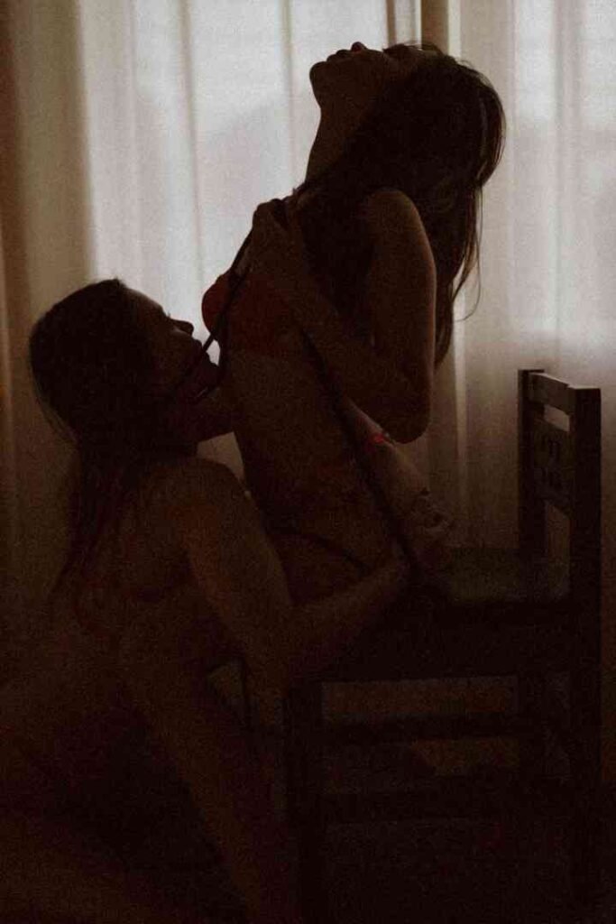 KL Escort Girl Silhouettes of two people in an intimate moment against a softly lit window. Sex Service Malaysia