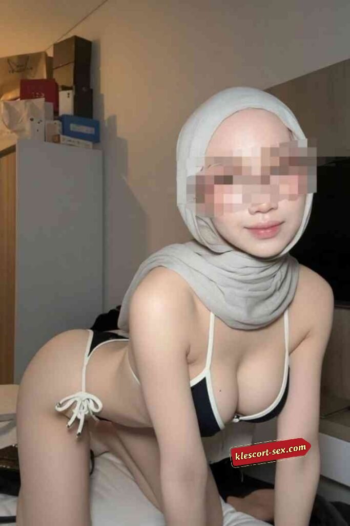 KL Escort Girl Woman in hijab and bikini posing on a bed Sex Service Malaysia